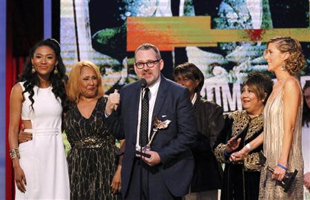 Director Morgan Neville with the cast of "20 Feet from Stardom" accepts the best documentary award at the 2014 Film Independent Spirit Awards in Santa Monica, California March 1, 2014. REUTERS/Robert Galbraith