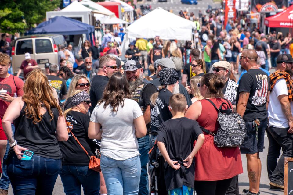 Thousands attend the National Road Bike Show on Wheeling Avenue on Saturday, June 17 in Cambridge. The Warthogs motorcycle club judged the motorcycles, while food trucks filled the air with the sweet smell of barbeque.