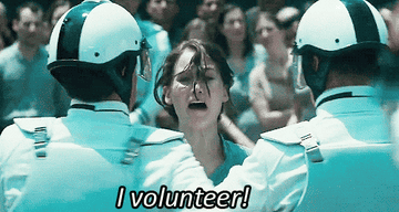 Katniss from Hunger Games yelling, "I volunteer!"