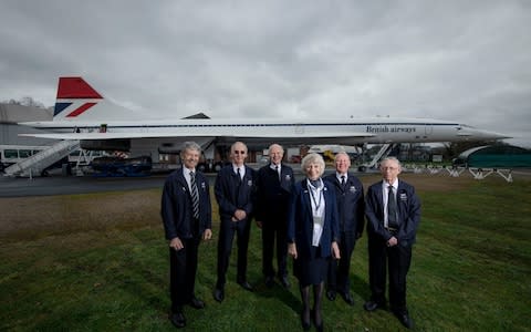 Former Concorde pilots gather around 'Delta Golf' (the first Concorde to carry 100 passengers) at Brooklands, Weybridge. From left to right, Ian Smith, pilot, Tony Heald, pilot, Brian Oliver, pilot, Carol Cornwell, cabin crew, Ian Smith, flight engineer, and Viv Gunton, pilot, Captain Mike Bannister, chief pilot, and Carol Cornwell, cabin crew - Credit: Geoff Pugh for the Telegraph&nbsp;