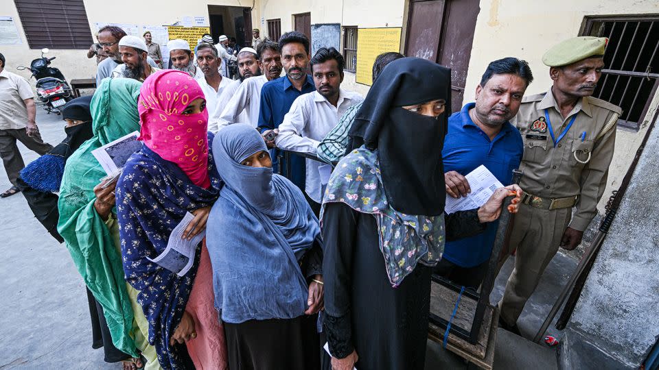 Voters queue at a polling station during the first phase of voting for national elections in Muzaffarnagar district, Uttar Pradesh, India, on Friday, April 19, 2024. - Prakash Singh/Bloomberg/Getty Images