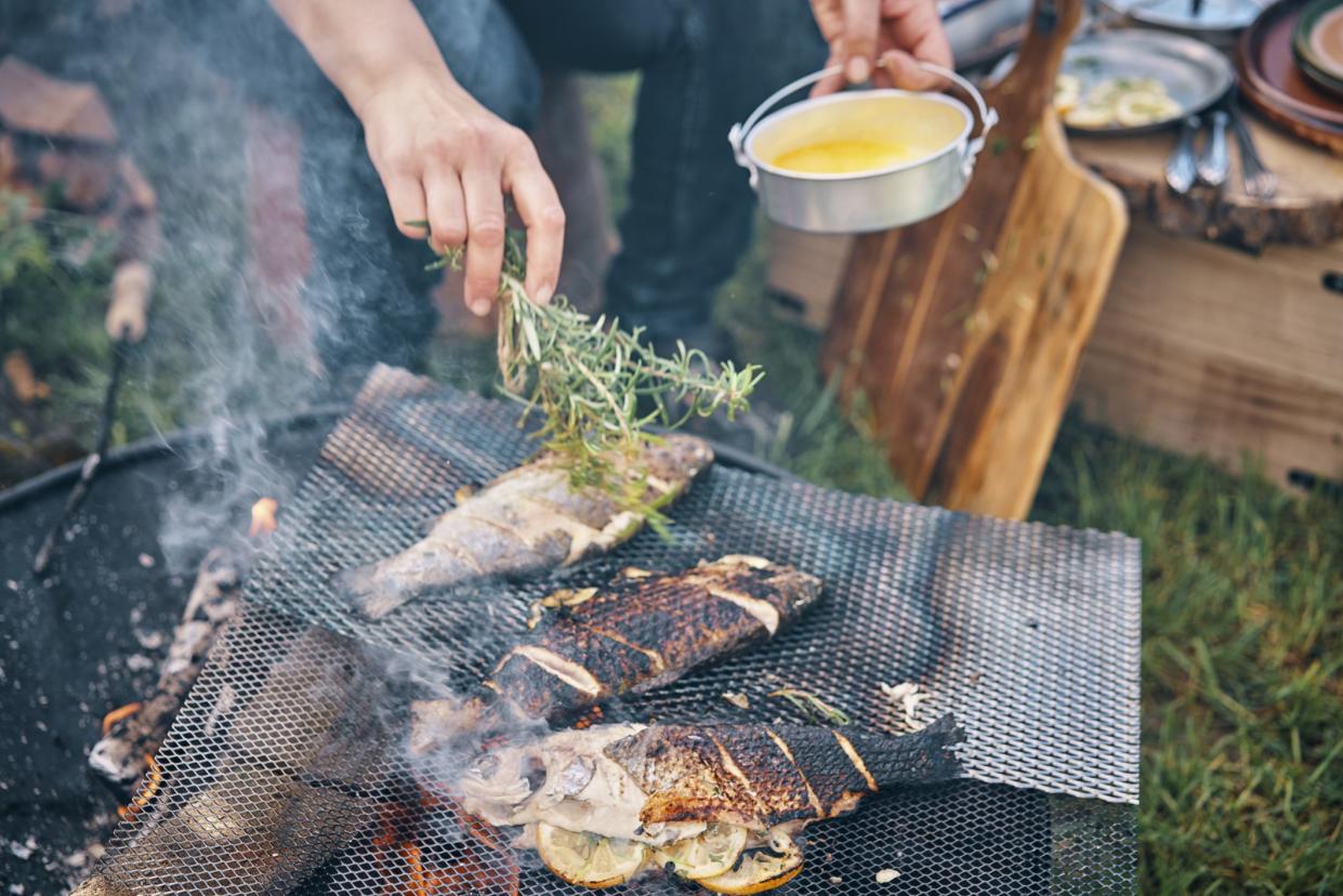 Preparing Fish for Cooking Over Open Campfire