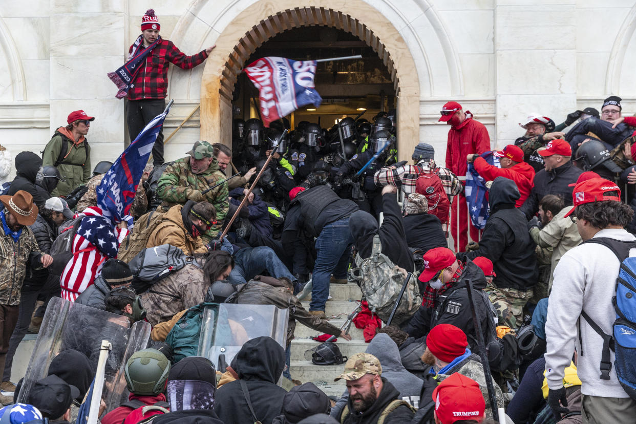 Rioters clash with police trying to enter Capitol building through the front doors on Jan. 6, 2021. (Lev Radin/Pacific Press/LightRocket via Getty Images)