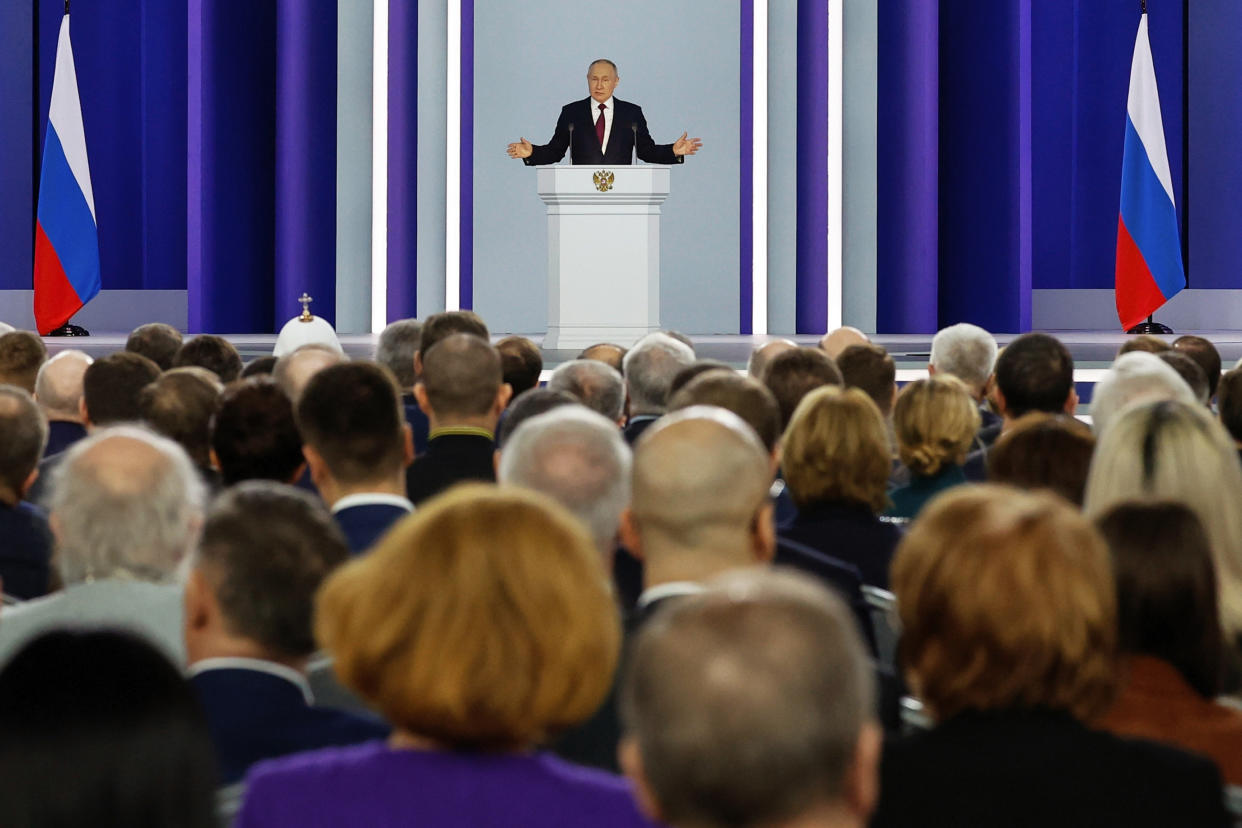 Russian President Vladimir Putin gestures as he gives his annual state of the nation address in Moscow, Russia, Tuesday, Feb. 21, 2023. (Dmitry Astakhov, Sputnik, Kremlin Pool Photo via AP)