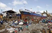 Cargo ships washed ashore are seen four days after super typhoon Haiyan hit Anibong town, Tacloban city, central Philippines November 11, 2013.