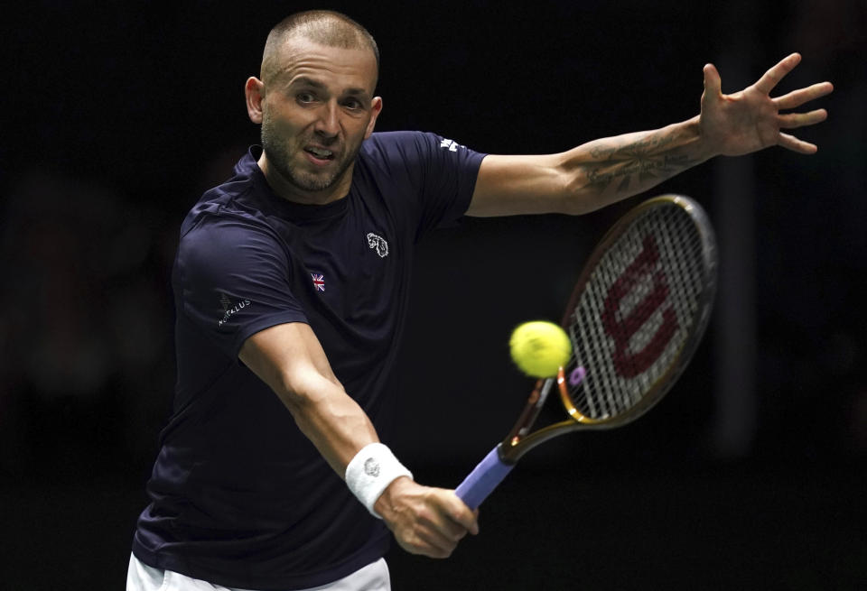 Britain's Daniel Evans in action against Australia's Alex de Minaur during the Davis Cup group stage tennis match at the AO Arena, Manchester, England, Wednesday, Sept. 13. 2023. (Martin Rickett/PA via AP)