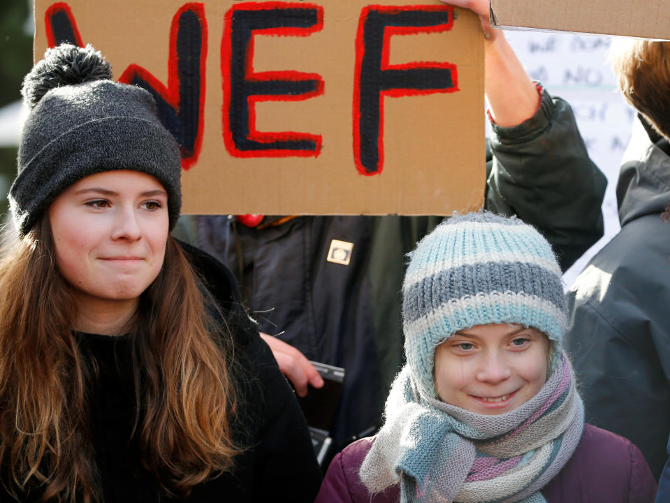Swedish climate change activist Greta Thunberg and German Luisa Neubauer take part in a climate strike protest during the 50th World Economic Forum (WEF) annual meeting in Davos, Switzerland January 24, 2020. REUTERS/Denis Balibouse