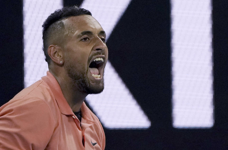 Australia's Nick Kyrgios reacts during his second round singles match against France's Gilles Simon at the Australian Open tennis championship in Melbourne, Australia, Thursday, Jan. 23, 2020. (AP Photo/Lee Jin-man)