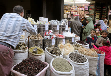 A worker at herbal store takes ingredients to prepare natural herbal drug, in Cairo, Egypt January 10, 2017. REUTERS/Mohamed Abd El Ghany