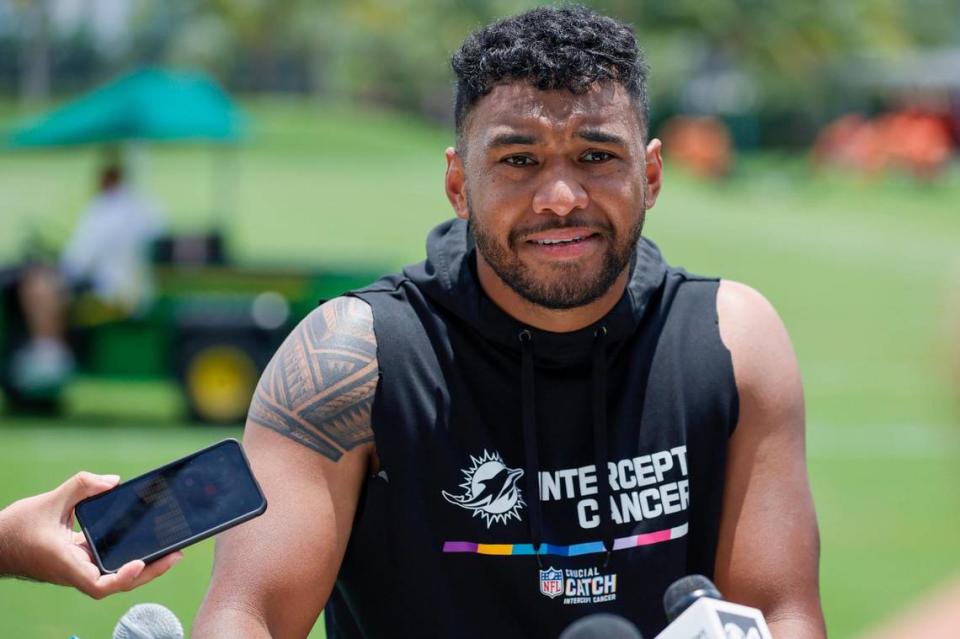 Miami Dolphins quarterback Tua Tagovailoa (1) talks to reporters after working out during mandatory minicamp at the Baptist Health Training Complex in Miami Gardens, Florida on Wednesday, June 7, 2023.