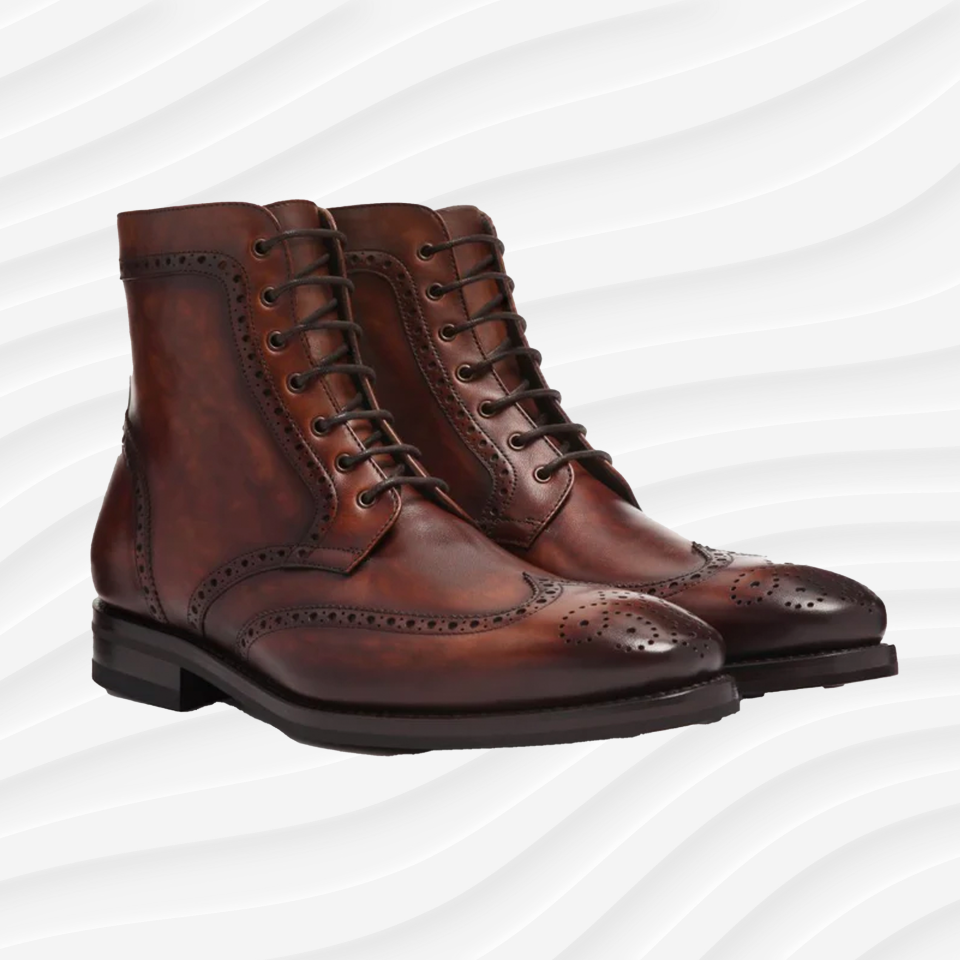 the thursday boot co wingtip boots in brown on a white wavy background