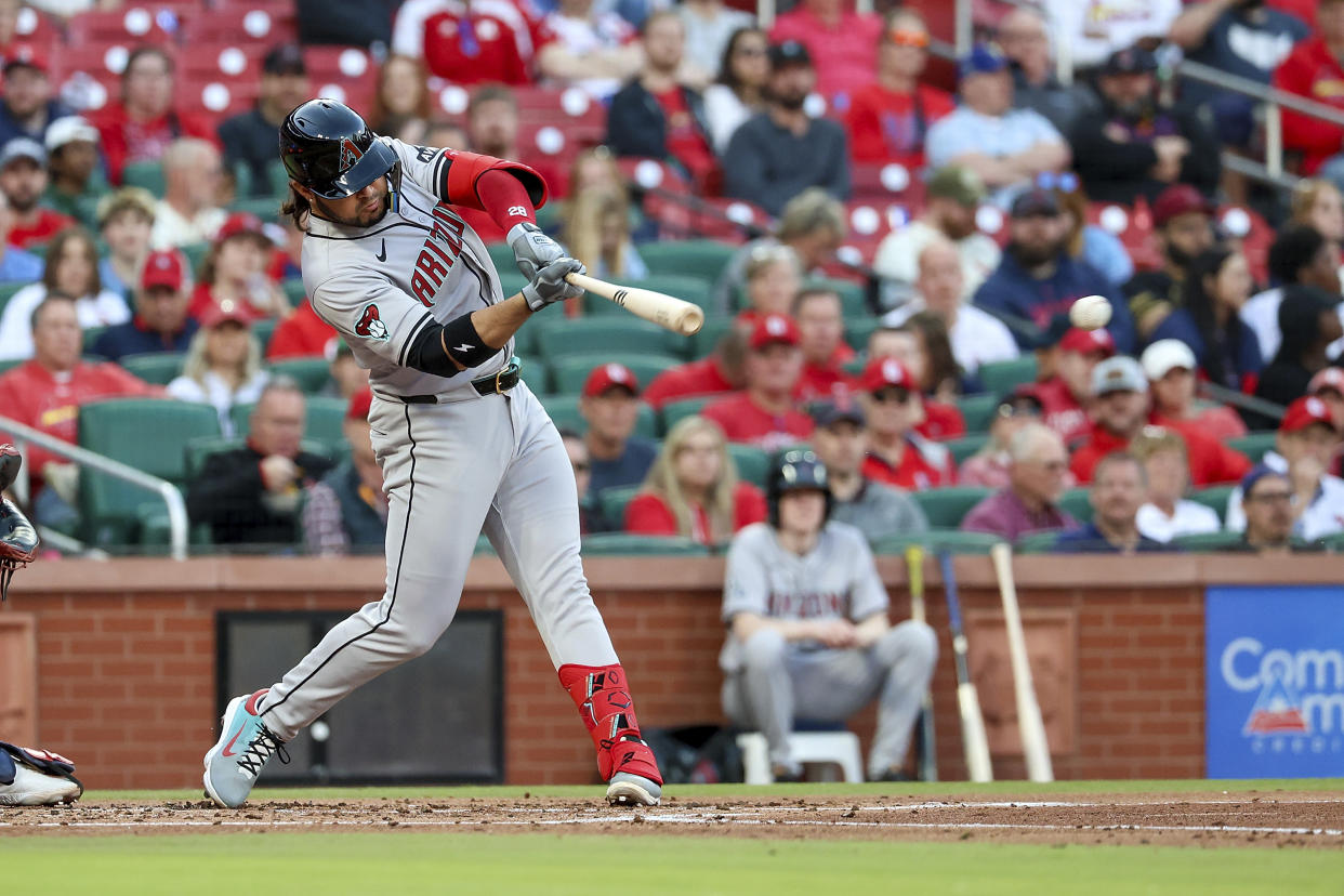 Arizona Diamondbacks' Eugenio Suarez hits an RBI single during the second inning of a baseball game against the St. Louis Cardinals, Monday, April 22, 2024, in St. Louis. (AP Photo/Scott Kane)