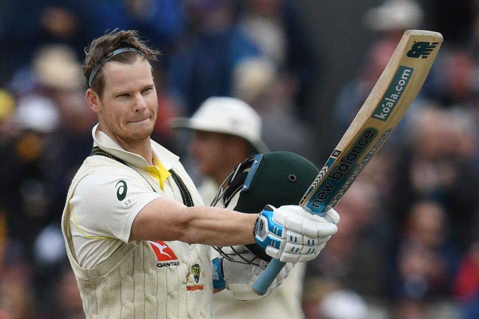 Australia's Steve Smith celebrates making 100 runs on the second day of the fourth Ashes cricket Test match between England and Australia at Old Trafford in Manchester, north-west England on September 5, 2019. -  (Photo by Paul ELLIS / AFP) / RESTRICTED TO EDITORIAL USE. NO ASSOCIATION WITH DIRECT COMPETITOR OF SPONSOR, PARTNER, OR SUPPLIER OF THE ECB        (Photo credit should read PAUL ELLIS/AFP/Getty Images)