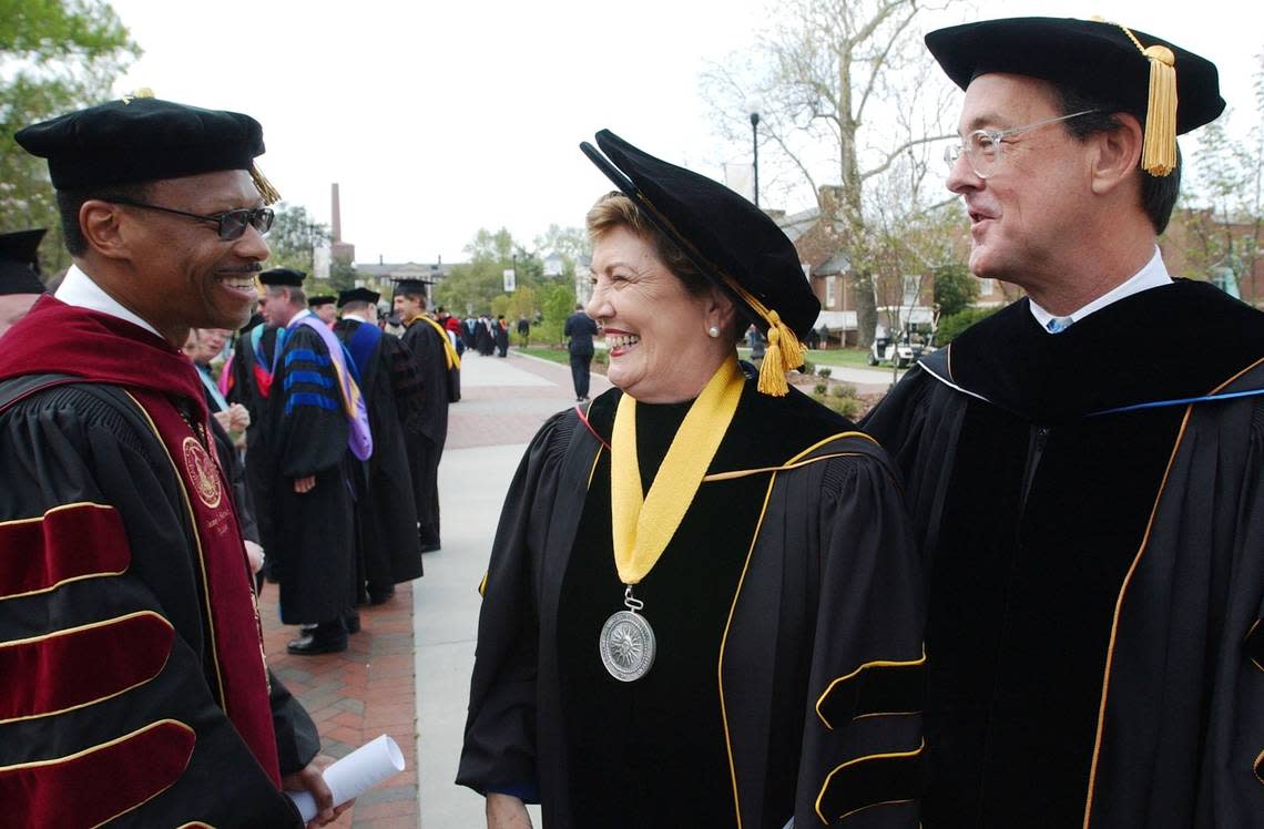 North Carolina Central University Chancellor James H. Ammons, Jr. sees both Molly Broad, past UNC system president and Erskine Bowles, UNC system president, stop to greet Ammons as they head toward the rear of the processional before the start of the official inauguration ceremony for Bowles at Aycock Auditorium at the University of North Carolina at Greensboro on Wednesday, April 12, 2006.