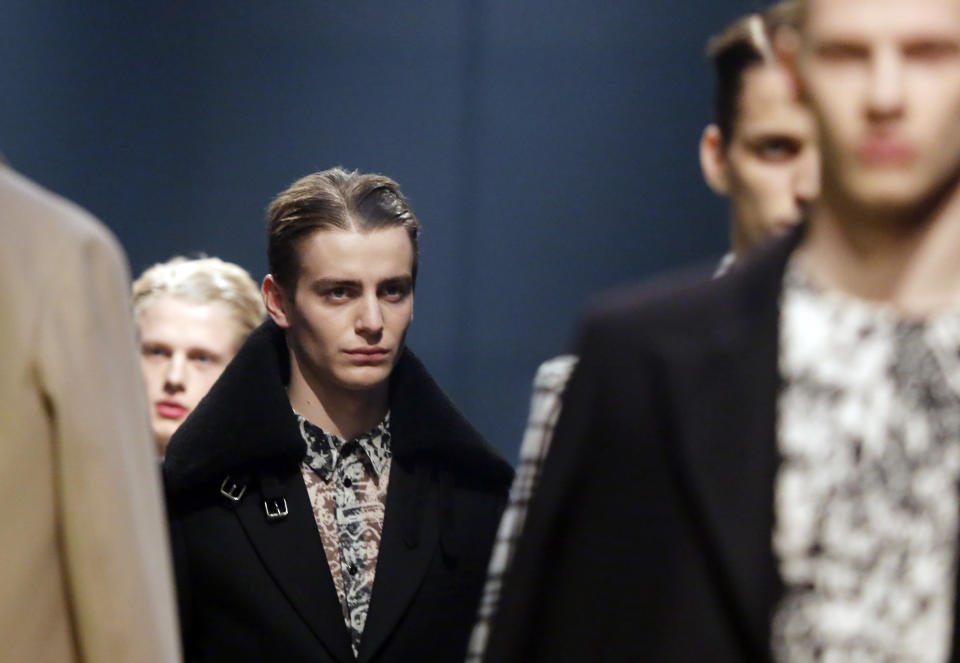 Models wears creations during the presentation of Carven men's fall-winter 2014-2015 fashion collection, designed by French fashion designer Guillaume Henry and presented in Paris, Wednesday, Jan.15, 2014. (AP Photo/Jacques Brinon)