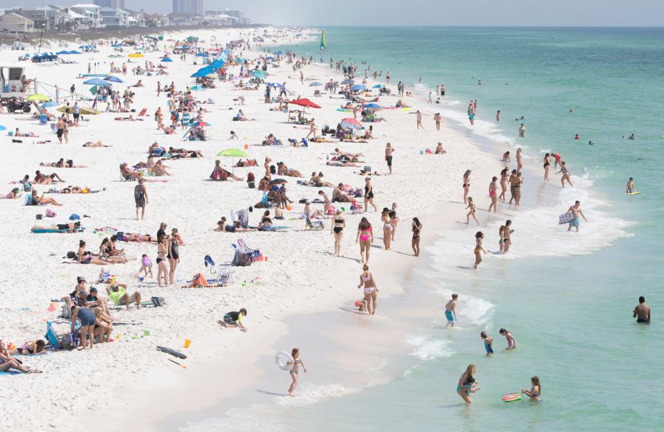 The shore is crowded during spring break at Casino Beach in Pensacola.