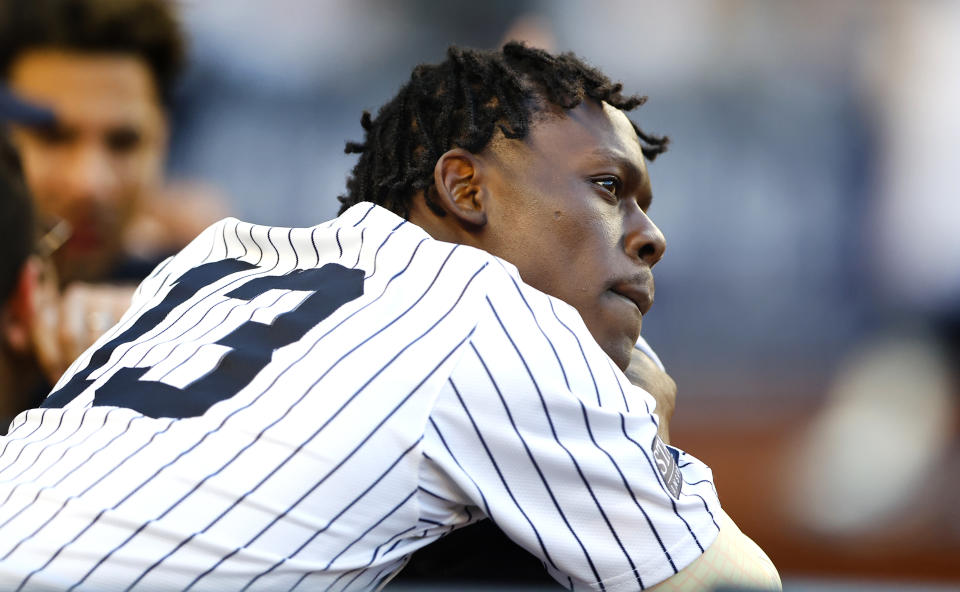 Jazz Chisholm Jr. (13) of the New York Yankees looks out from the dugout during the eighth inning of the second game of a baseball doubleheader against the Texas Rangers, Saturday, Aug. 10, 2024, in New York. (AP Photo/Noah K. Murray)