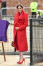 <p>Markle looked like a marvelous mother-to-be in a bright red wrap coat from Sentaler. </p>