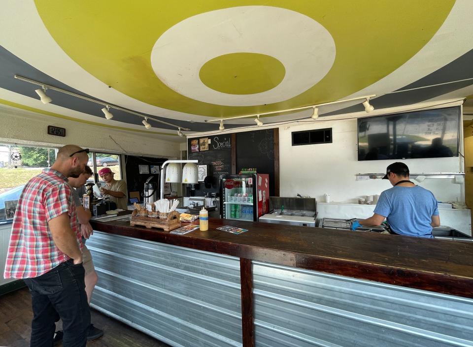 Staff at Tazmez Barbecue fill orders for walk-in customers and at the pick-up window for online orders in Athens, Ga. on Friday, Aug. 25, 2023.