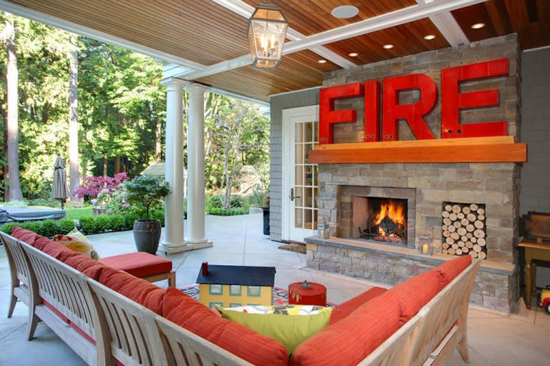 <p>Fiery style turns this back patio into a gorgeous outdoor room. Use your fire pit as the focal point for a decorating scheme that brings your home's style outdoors.</p>