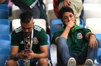 <p>Mexico fans look dejected following their sides defeat in the 2018 FIFA World Cup Russia Round of 16 match between Brazil and Mexico at Samara Arena on July 2, 2018 in Samara, Russia. (Photo by Matthias Hangst/Getty Images) </p>