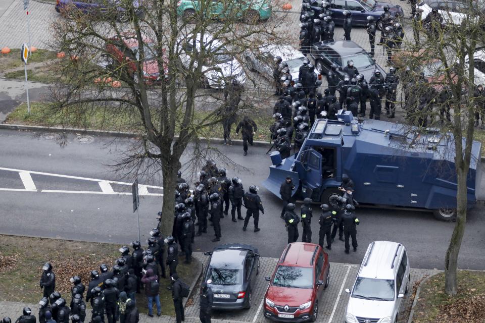 Belarusian riot police block the road to stop demonstrators during an opposition rally to protest the official presidential election results in Minsk, Belarus, Sunday, Nov. 15, 2020. Protests have rocked Belarus since the August election that official results say gave Lukashenko a sixth term in office but that opponents and some polls workers claim were manipulated. (AP Photo)