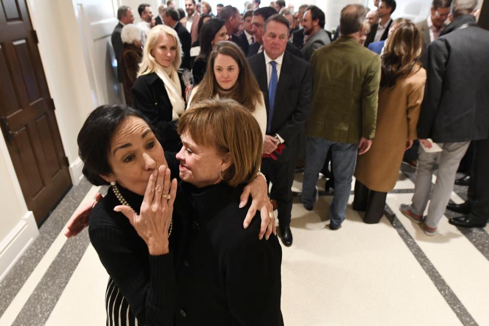 Jan 19, 2024; Tuscaloosa, AL, USA; The University of Alabama officially opened the Catherine and Pettus Randall Welcome Center in the historic Bryce Main building Friday. Cathy Randall blows kisses as she hugs Kathy Mouron as a crowd of well-wishers wait to greet her in the main entry hall.