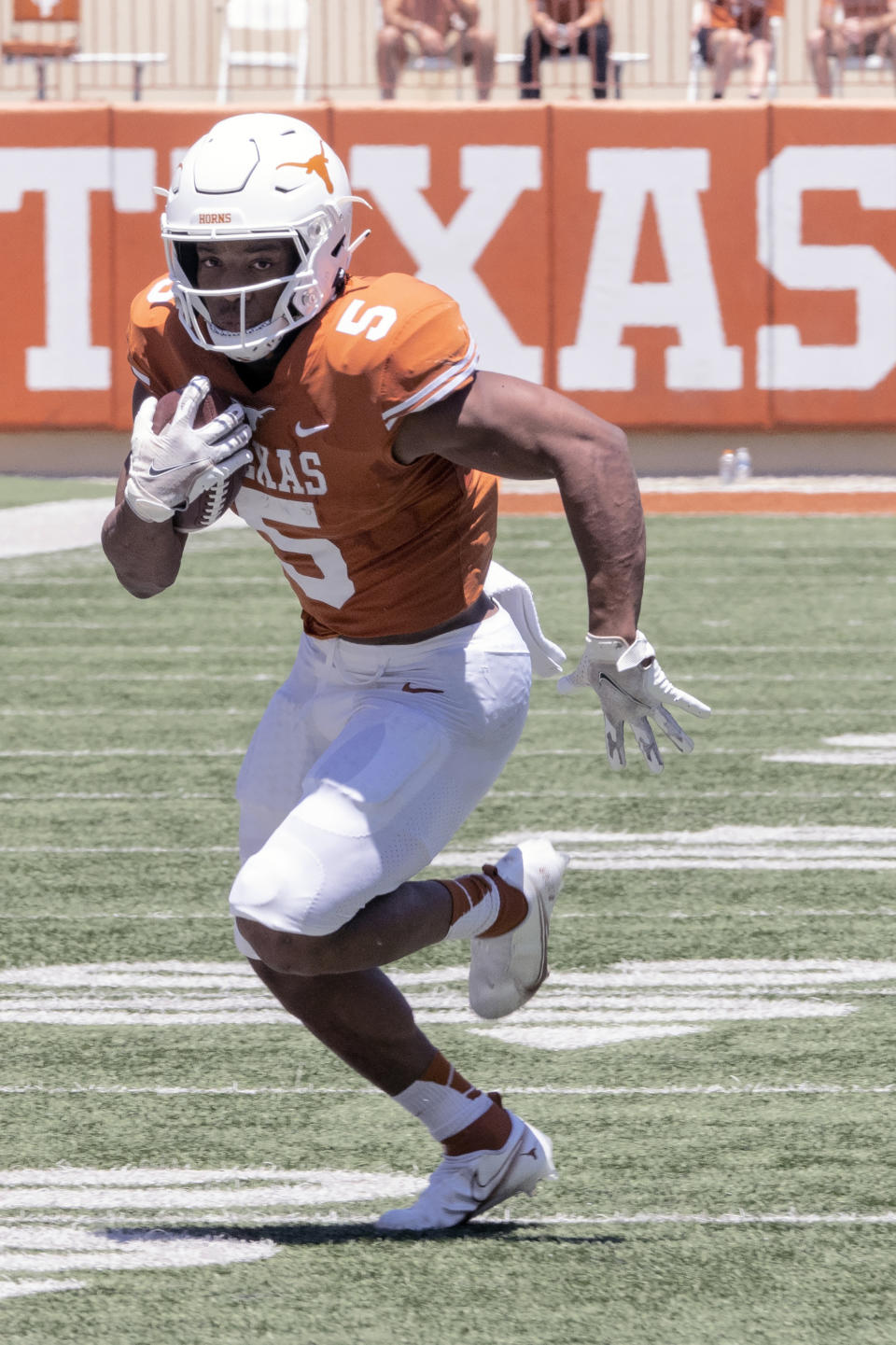 FILE - Texas running back Bijan Robinson (5) runs during the final half of the Texas Orange and White Spring Scrimmage in Austin, Texas, in this Saturday, April 24, 2021, file photo. No player frustrated Texas fans last season more than tailback Bijan Robinson. Not because of anything he did, but because of Herman’s odd refusal to give him the ball more often. (AP Photo/Michael Thomas, File)