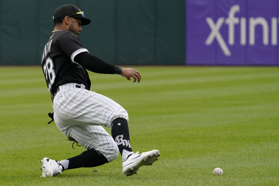 Chicago White Sox shortstop Leury Garcia makes a fielding error on a ball hit by Baltimore Orioles' Cedric Mullins hit during the fifth inning of a baseball game in Chicago, Saturday, June 25, 2022. (AP Photo/Nam Y. Huh)