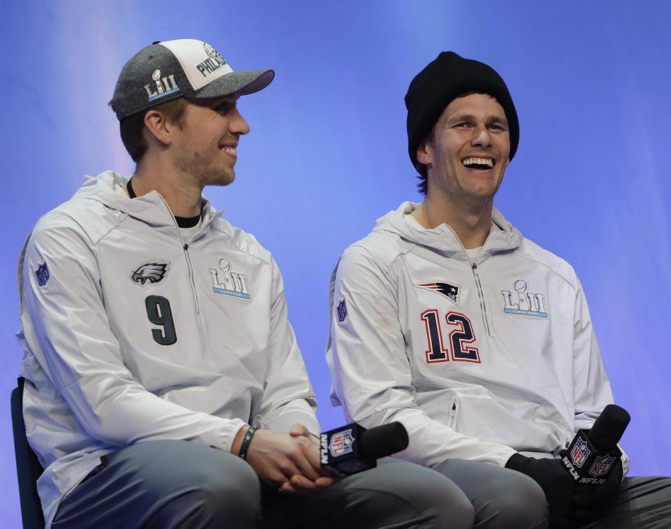 Nick Foles and Tom Brady, shown before Super Bowl LII, will meet again on Thursday night. (AP Photo/Eric Gay)