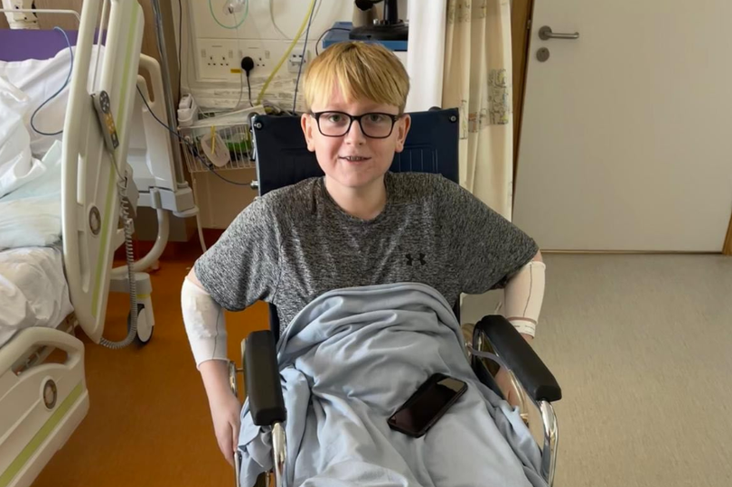 Oliver smiling in hospital during his recovery