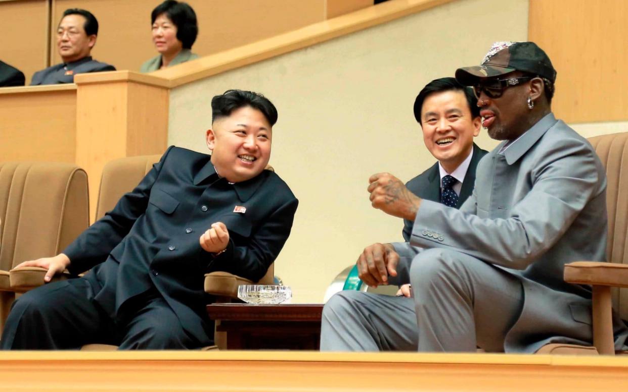 Kim Jong Un and Dennis Rodman watch a basketball game between former US NBA basketball players and North Korean players in Pyongyang in 2014 - Reuters