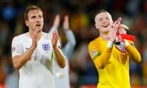 Harry Kane (left) and Jordan Pickford applaud the fans after England’s victory against Spain Seville.