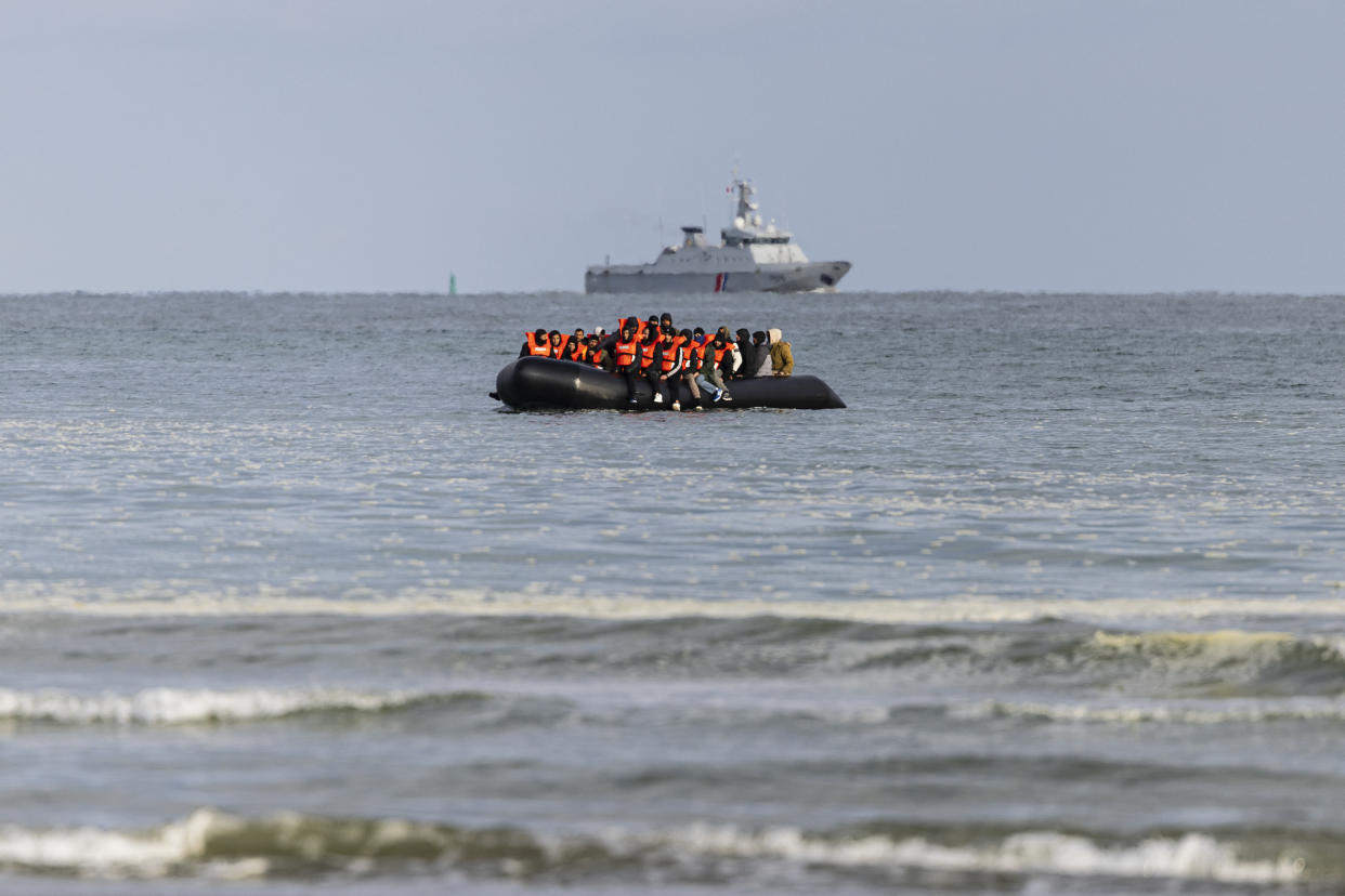 Migrants board a smuggler's boat in an attempt to cross the English Channel, on the beach of Gravelines, near Dunkirk, northern France on April 26, 2024. (Photo by SAMEER AL-DOUMY/AFP via Getty Images)
