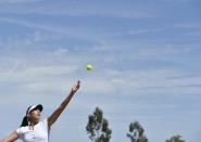 Garbine Muguruza of Spain serves during a practice session at the Wimbledon Tennis Championships in London, July 10, 2015. REUTERS/Toby Melville