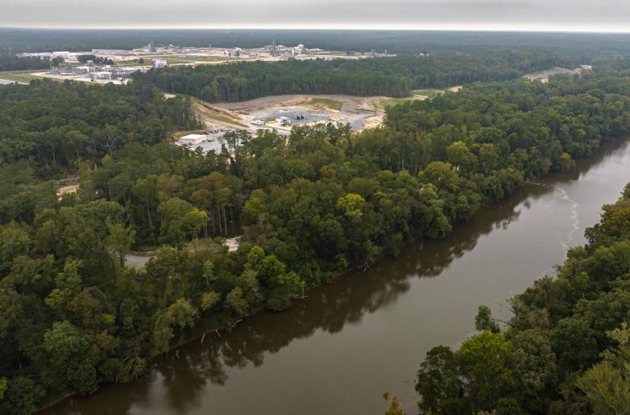 <span>A chemical slick is discharged from a pipe at the edge of the Chemours/DuPont plant in Fayetteville, North Carolina, on 26 September 2023.</span><span>Photograph: Justin Cook/The Guardian</span>