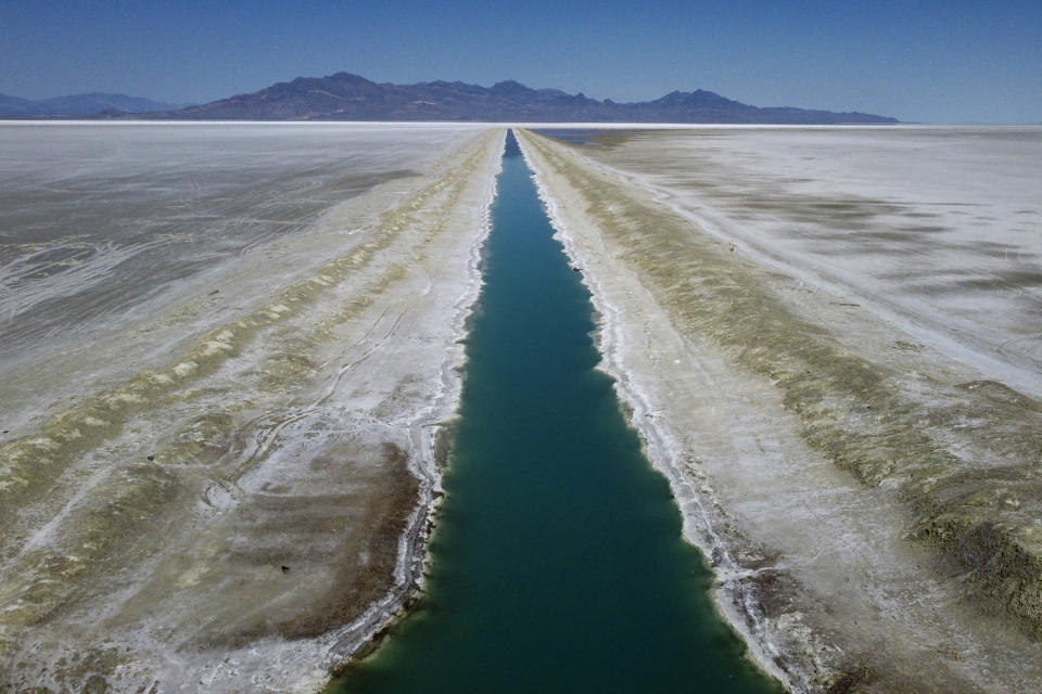 The Intrepid Potash canal is shown at the Bonneville Salt Flats on Monday, Aug. 29, 2022, near Wendover, Utah. Potash is potassium-based salt primarily used throughout the world as a fertilizer for crops such as corn, soy, rice and wheat. It’s extracted in 13 countries throughout the world, mainly from prehistoric lakebeds like Bonneville's. (AP Photo/Rick Bowmer)