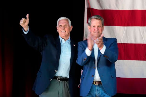 PHOTO: Former Vice President Mike Pence, left, and Georgia Gov. Brian Kemp, right, greet the crowd during a Get Out the Vote Rally, May 23, 2022, in Kennesaw, Ga. (Brynn Anderson/AP, FILE)
