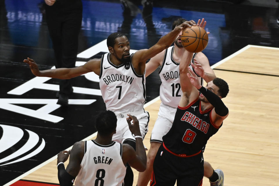Brooklyn Nets forward Kevin Durant (7) blocks a shot by Chicago Bulls guard Zach LaVine (8) during the second half of an NBA basketball game Tuesday, May 11, 2021, in Chicago. (AP Photo/Matt Marton)