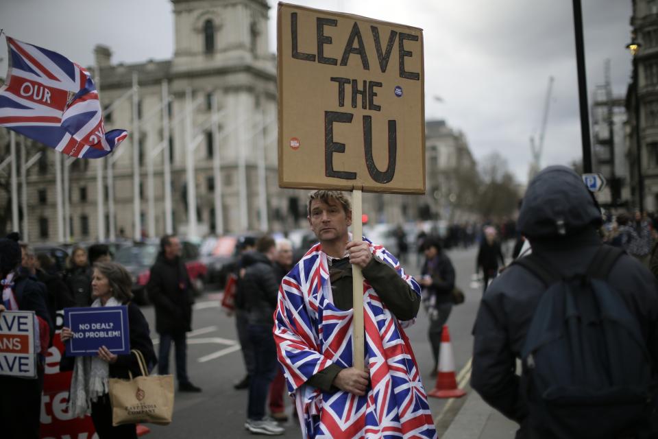 Pro-Brexit leave the European Union supporters take part in a protest outside the House of Parliament in London, Wednesday, March 13, 2019. British lawmakers rejected May's Brexit deal in a 391-242 vote on Tuesday night. Parliament will vote Wednesday on whether to leave the EU without a deal. (AP Photo/Tim Ireland)