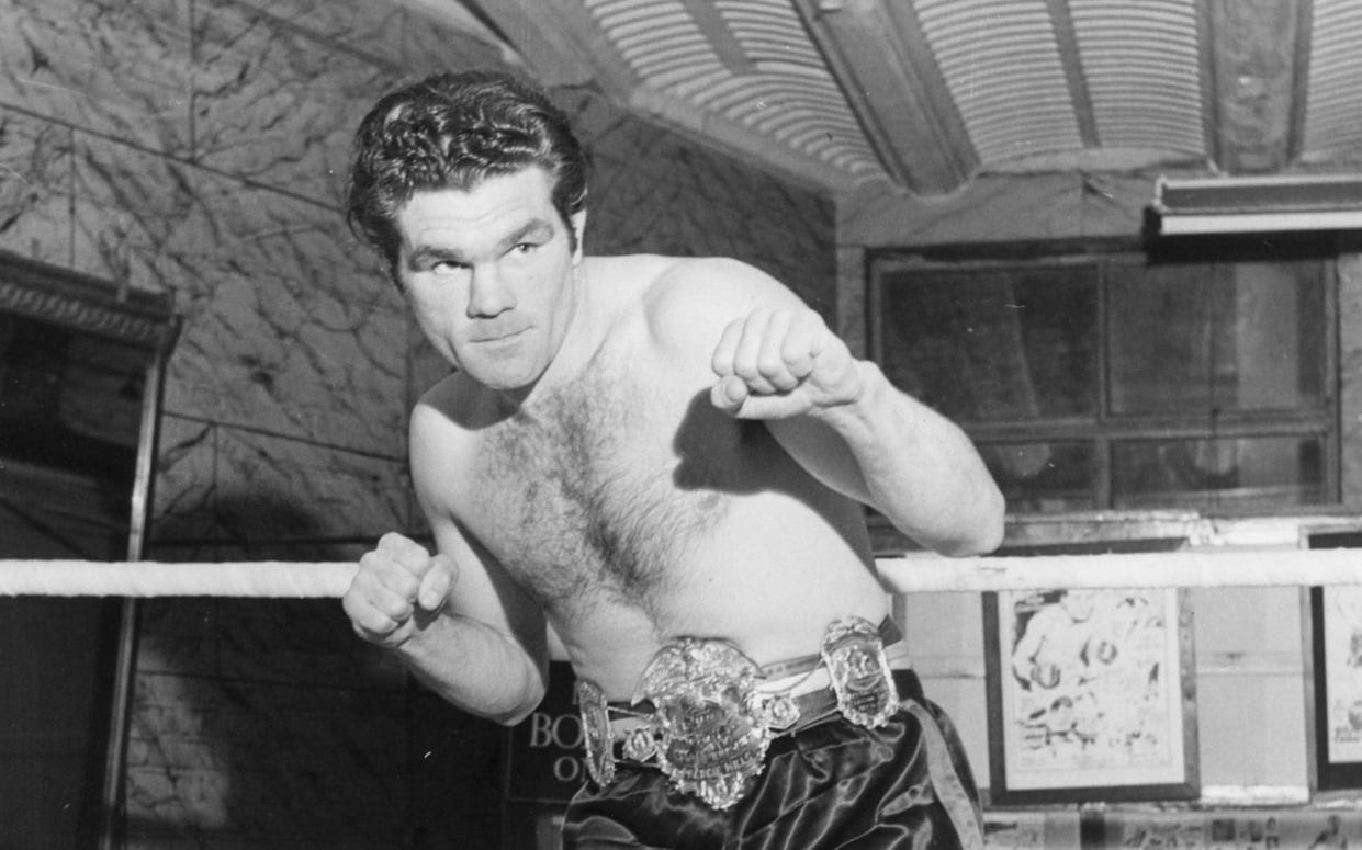 Freddie Mills, winner of the 1948 World Light Heavyweight title, at his London gym - Hulton Archive