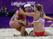 LONDON, ENGLAND - AUGUST 08: Kerri Walsh Jennings (R) and Misty May-Treanor of the United States celebrate winning the Gold medal in the Women's Beach Volleyball Gold medal match against the United States on Day 12 of the London 2012 Olympic Games at the Horse Guard's Parade on August 8, 2012 in London, England. (Photo by Jamie Squire/Getty Images)