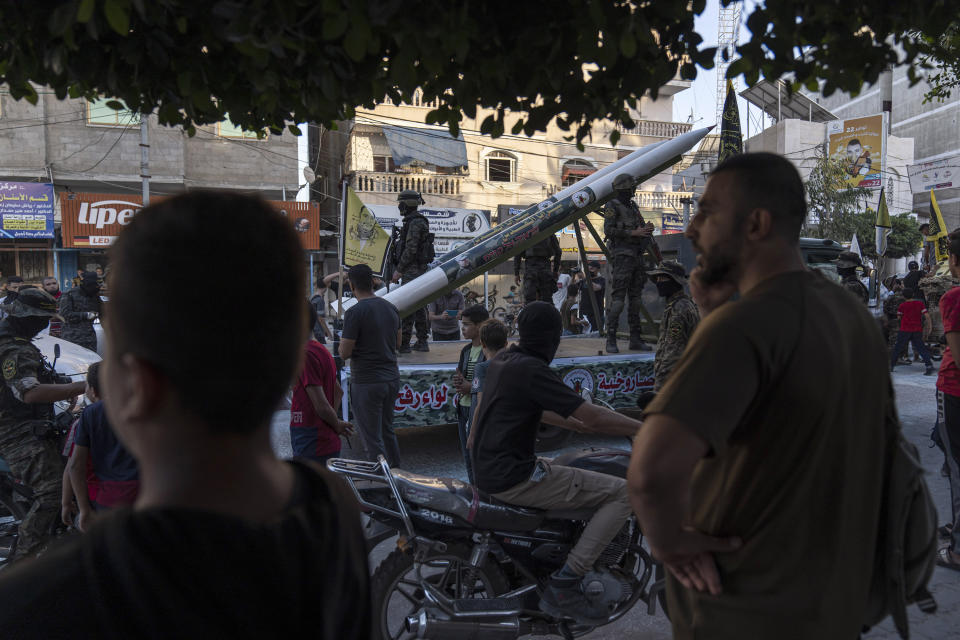 Palestinian fighters from Islamic Jihad display weaponry at in an anti-Israel rally in Rafah, south of Gaza City, Wednesday, Aug. 24, 2022. (AP Photo/Fatima Shbair)