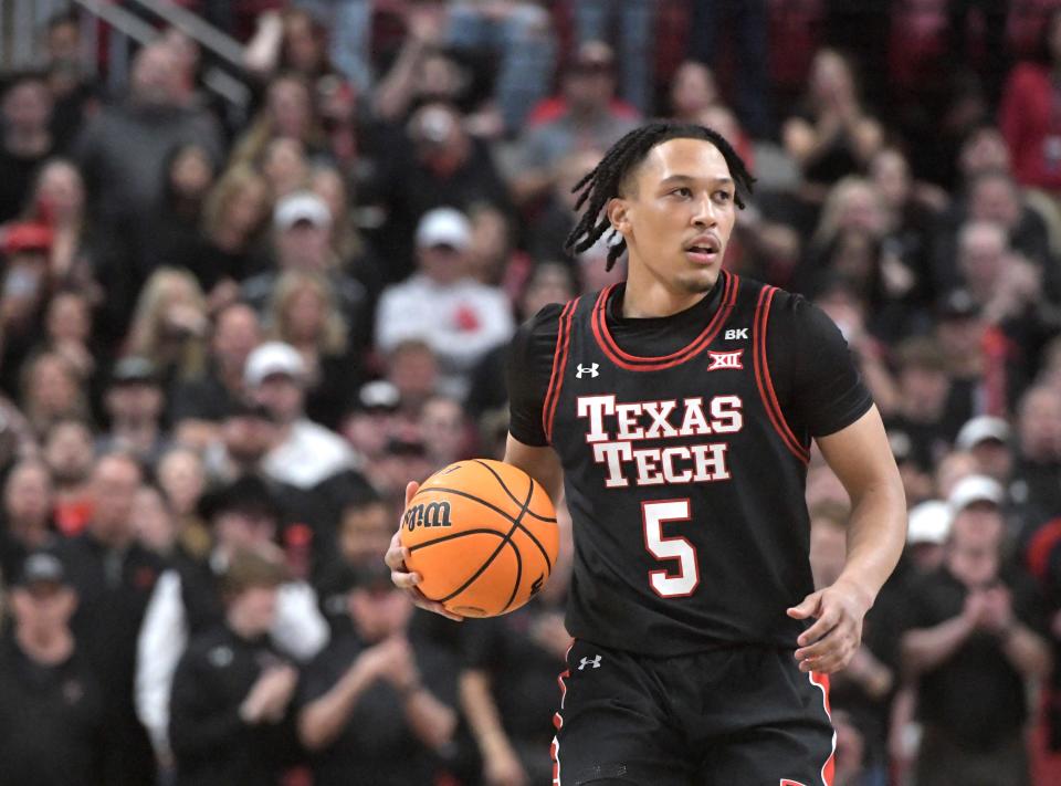 Texas Tech's guard Darrion Williams (5) dribbles the ball against Texas in a Big 12 basketball game, Tuesday, Feb. 27, 2024, at United Supermarkets Arena.