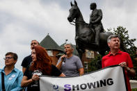 <p>Protesters gather below a monument dedicated to Confederate Major John B. Castleman while demanding that it be removed from the public square in Louisville, Ky., Aug.14, 2017. (Photo: Bryan Woolston/Reuters) </p>