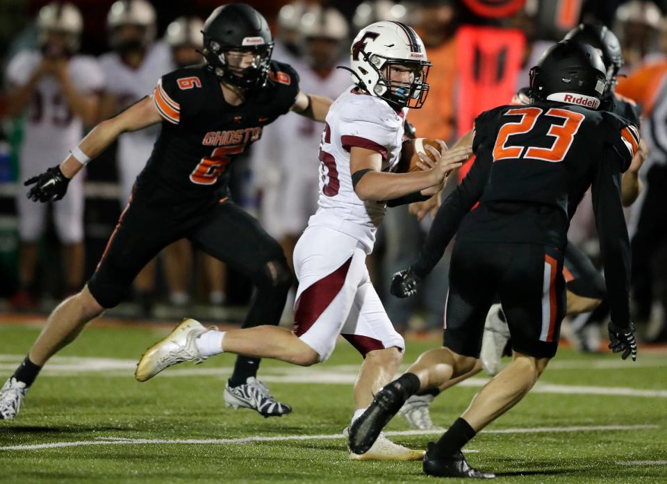 Fond du Lac's Brayden Eigenbrodt (16) runs against Kaukauna during a Fox Valley Association football game Sept. 23 in Kaukauna.