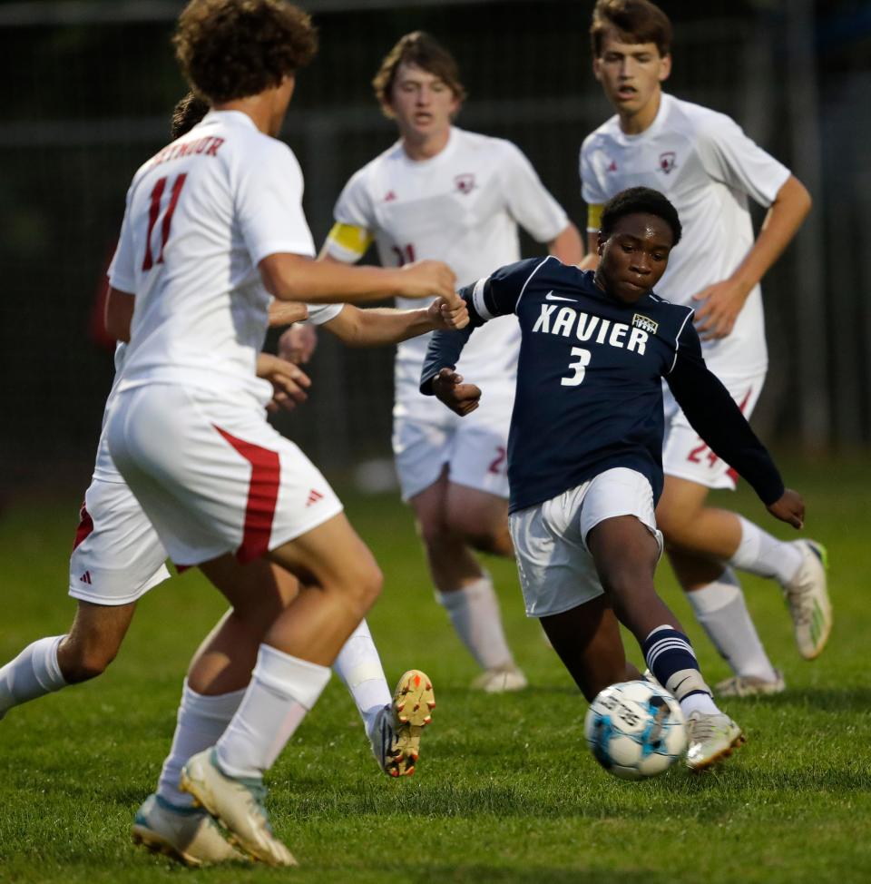 Xavier's Richard Makope (3) scores a goal against Seymour during a Bay Conference boys soccer game Sept. 26 in Appleton.