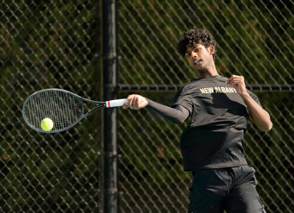 New Albany junior Abhinav Dandu returns a shot during a recent practice. The Eagles' top singles player this spring, Dandu is two wins from qualifying for his first Division I state tournament.
