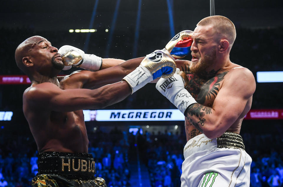 Nevada , United States - 26 August 2017; Conor McGregor, right, and Floyd Mayweather Jr during their super welterweight boxing match at T-Mobile Arena in Las Vegas, USA. (Photo By Stephen McCarthy/Sportsfile via Getty Images)