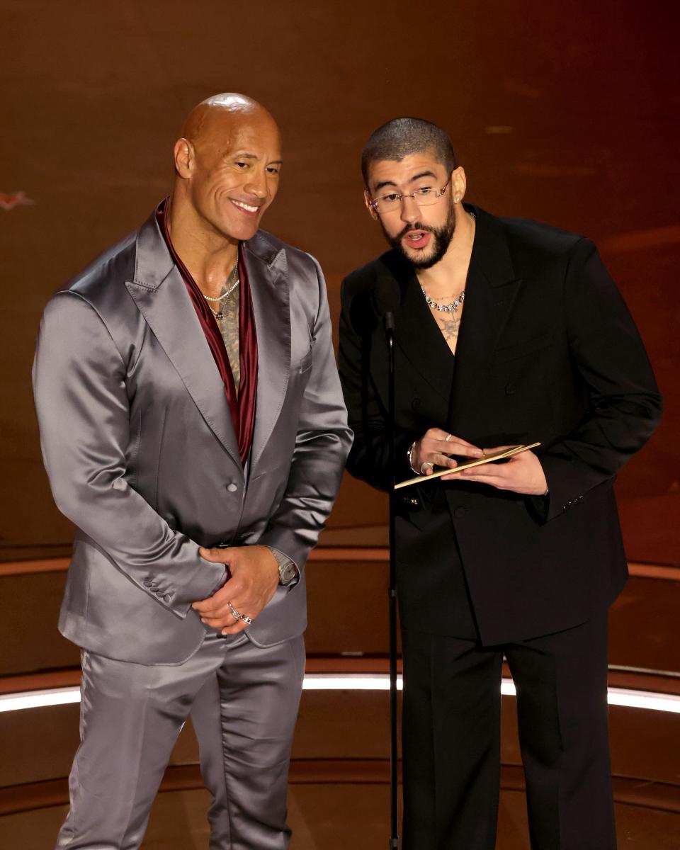 Dwayne “The Rock” Johnson (in Dolce & Gabbana) and Bad Bunny (in Gucci) demonstrated another version of the no-tie suit: the no-shirt suit.